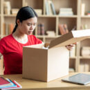 A frustrated young woman wearing a red shirt realizes she make a mistake on her personalized gift order.